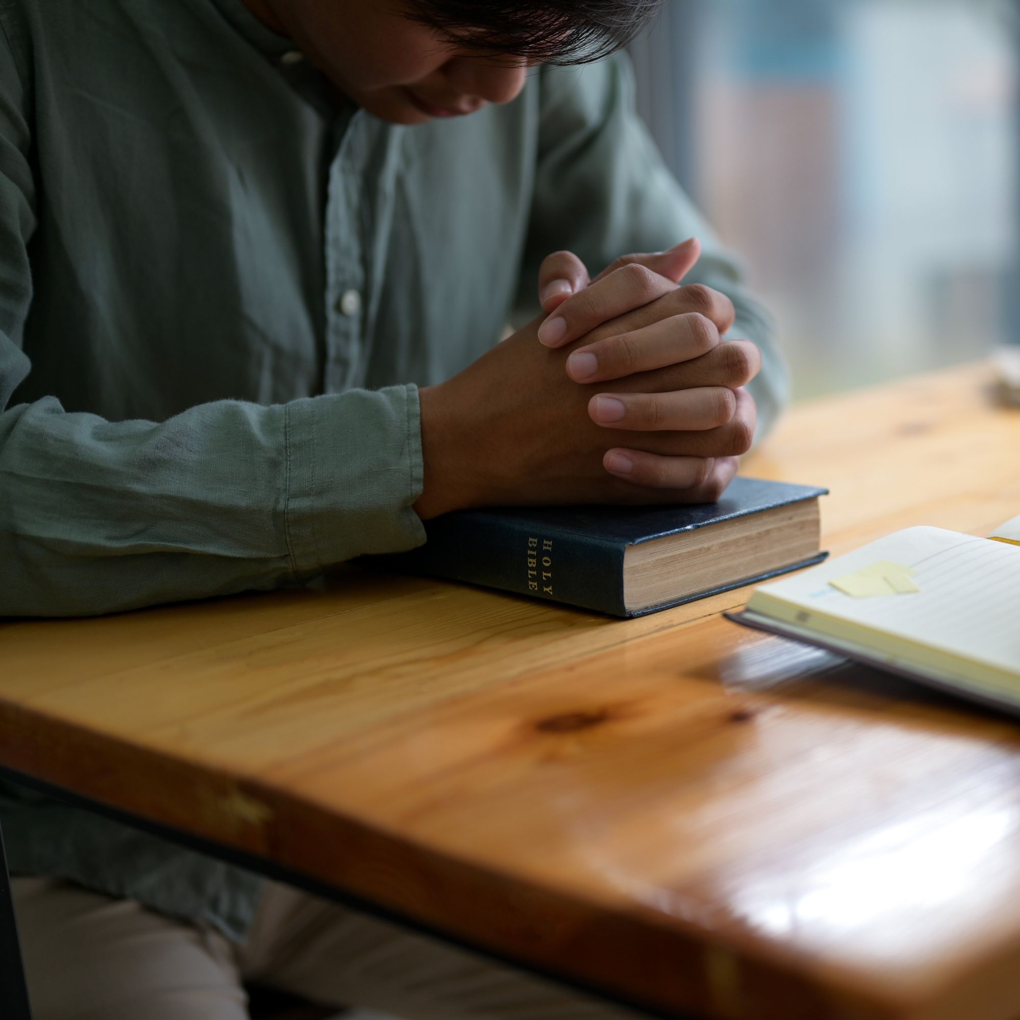 cropped-shot-of-worshiping-god-with-the-bible-2024-12-07-01-11-06-utc